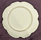 Hand-painted Porcelain Cabinet Plate With Floral Motifs And Scalloped Trim