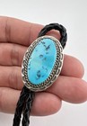 Vintage Navajo Sterling Silver Sleeping Beauty Turquoise Stamped Oval Bolo Tie