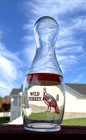 Wild Turkey Bourbon Bowling Pin Glass  Red Logo And Plastic Seal  Set Of 1