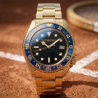 Winborn Montier Gold Tone Watch Black Dial Blue 24 Hour Bezel Date Bracelet