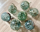 7 Japanese Antique Glass Fishing Floats W  Nets     Used     Approx  3 -3 3  Dia