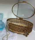 Vintage Gold Filigree Ormolu Oval Casket With Beveled Glass Hollywood Regency