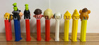 Pez - Pluto No Feet  Goofy  Wood Stock  Snoopy  Fozzy Bear  Boy And Girl