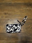 Vera Bradley Wristlet In A Black And White Floral Pattern And Wrist Strap