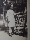 Girl Near Display Of Vintage Photos 1920 s Vintage Photo