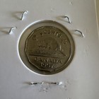 1957 Canadian Five-cent Coin Featuring A Portrait Of Queen Elizabeth Ii Bug Tail