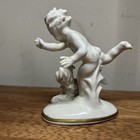 Vintage Porcelain Figurine Decorative  Pekingese Dog Frolicking W  Cherub German