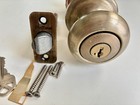 Kwikset Juno Antique Brass Entry Door Knob Featuring Smartkey