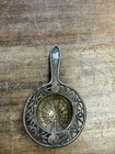 Silver Tea Strainer With Perforated Bowl And A Handle