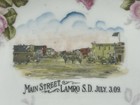 Vtg Lamro South Dakota Souvenir Plate July 3  1909 Main Street Livery Bank