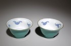 A Pair Of Blue And White Cups
