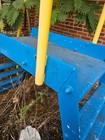 Blue And Yellow Crossover Stairs With Safety Rails  