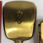 Vintage 3-piece Vanity Dresser Set Hand Mirror  Nylon Brush  Comb Gold Plated