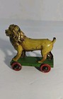 German Tin Litho Lion Pull Penny Toy On Green Stand Rare 