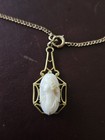 Vintage Ivory Cameo Oval Pendant Necklace With Gold Tone Ornate Filigree Frame