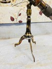 Antique Brass Telescope With Brass Stand And A Leather Finish Around The Tube
