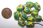 Antique Venetian Trade Beads -  11 Green Ovals With Yellow red Millefiori Eyes