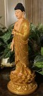 Buddha Statue  In A Golden Robe And A Lotus Base  
