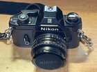 Nikon Em 35mm Camera  Series E 50 Mm Lens  2 Telephoto Lenses  2 Flash Modules  