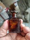 Small Amber Embossed Universal Bristol   s Recorder Ink Bottle