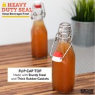 16 Ounce Clear Glass Beer Bottles For Home Brewing - 12 Pack With Flip Top Cap