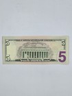  5 Dollar Bill  In A Serial Number Ml 22722244 M  2013