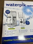 Waterpik Evolution And Nano Water Flosser - Combo Pack  new  Sealed Box