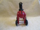Vintage Kouvalias Red Wooden Dog  Black Wheels Pull Toy