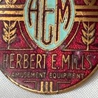 Vtg Herbert E Mills Emblem Amusement Equipment Hem Slots Badge Enamel Medal Logo