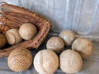 Vintage Baseball Glove And Nine Vintage Baseballs