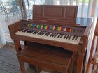 Vintage Electric Organ With Seat And Music Sheets