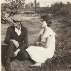 Vintage Snapshot Photo Depression Era Couple Newsboy Cap Billboard 1930s B w