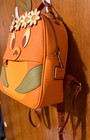 Loungefly Disney Parks Orange Bird Epcot Flower Garden Festival Mini Backpack