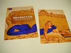 Shakira In Brilliant Blue Lying On Gold    2-piece 2023 Promo Display Ad