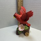 A Bright Red Northern Cardinal In A Dynamic Flight Pose 