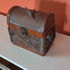 Rustic Wooden Treasure Chest With Leaf Carvings  Handle  Metal Latch  Brown