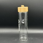 Wynk 9 25 Inch Glass Water Bottle With Beige Lid And Woven Strap Hydrate