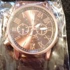 Rose Gold Analog Wristwatch Roman Numerals 12-hour Dial Brown Leather Strap