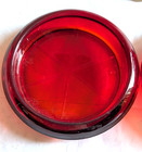 A Pair Of Red orange Colored Glass Coasters Starburst Pattern