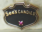      See s Candies Co  10k Candy Employee Service Award Advertising Tie lapel Pin