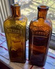 Pair Of Peruvian Bitters One Mint One Has A Couple Chips Great Contrast Colors