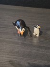 Hagen Renaker Penguin Speed Skating Bent Over Miniature Figure And Baby