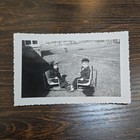 Vintage B w Photo Snapshot Of 2 Young Boys On Chairs Talking To Each Other