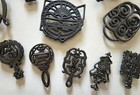 12 Vintage Cast Iron Trivets