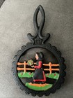 2 Vintage Trivets  Dalecraft Cast Iron Trivet Amish Woman Old-country Style Plus