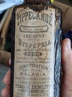    sealed    Labeled Amber Warner s Tippecanoe Bitters Bottle
