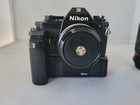 Nikon Em 35mm Film Camera Body And Lens Kit With Nikon Md-14