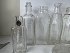 Lot Of 9 Antique Vintage Embossed Glass Medicine Hair Tonic Extract Bottles