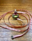 Antique Figural Tape Measure C1900 Hand Painted Metal Doll Sewing Novelty Tool