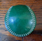 Older Green Baseball Weighted Practice Ball